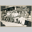 Group of young people sitting on bench (ddr-densho-383-296)