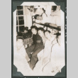 7 men sitting around radio (ddr-densho-540-50)