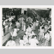 Soldiers from Allied Translator and Interpreter section dancing with civilians in post-war Tokyo (ddr-densho-1007-98)