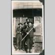 Four men standing outside barracks (ddr-ajah-2-54)