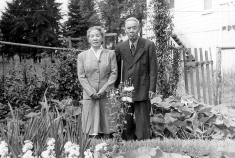 Issei couple in front of their postwar home (ddr-densho-2-37)
