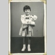 A girl holding a doll (ddr-manz-4-160)