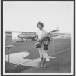 Nisei woman poses at airfield (ddr-densho-363-70)