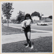 Girl holding dog (ddr-densho-522-108)