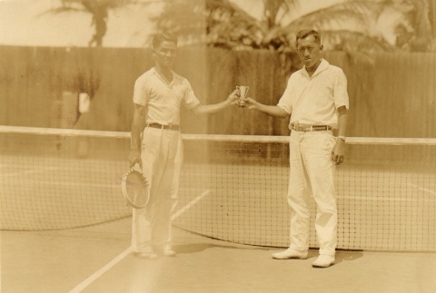 Two tennis players posing with a trophy (ddr-njpa-4-1268)