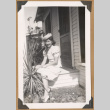 Anna Nose sitting on a porch (ddr-densho-542-57)