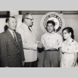 Japanese Consul-General, Hawaii Red Cross workers and a fisherman (ddr-njpa-2-1110)