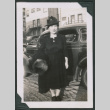 Photo of a woman beside a car (ddr-densho-483-366)