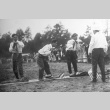 Issei men playing a game at a community picnic (ddr-densho-13-7)