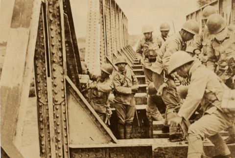 Soldiers preparing to detonate explosives on a bridge (ddr-njpa-6-101)