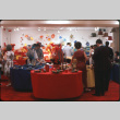 Group of people by table settings display (ddr-densho-426-370)