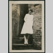 Woman poses outside building (ddr-densho-359-675)