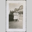 Two women in front of houses (ddr-densho-298-199)