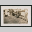 two women and a man sitting on dock (ddr-densho-378-773)