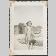 Girl standing by a flowerbed (ddr-densho-321-164)