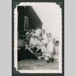 Seven men on steps outside barrack (ddr-densho-471-103)