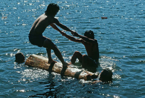 Campers log rolling in the lake (ddr-densho-336-1127)