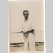 Man standing by ship's railing (ddr-densho-426-1555)