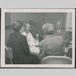 Four people seated at a table (ddr-densho-293-102)