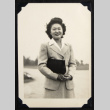 Smiling woman with a handbag (ddr-densho-542-751)
