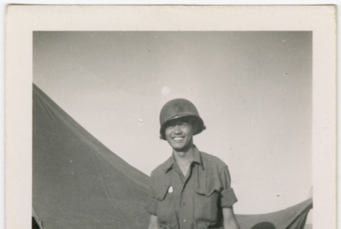 Saburo Arthur Kitagawa standing outside tent (ddr-densho-539-24)