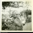 Nisei soldier holding a child (ddr-densho-179-68)