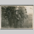 Photo of a man with a camera (ddr-densho-483-927)
