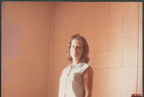 Woman standing in bedroom (ddr-densho-523-469)