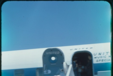 A woman and boy deboarding a plane (ddr-densho-338-508)