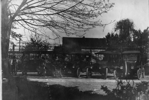 Kubota Gardening Company crew with parked cars (ddr-densho-354-130)