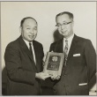 Yasuo Goto holding a 4-H club member plaque (ddr-njpa-5-1128)