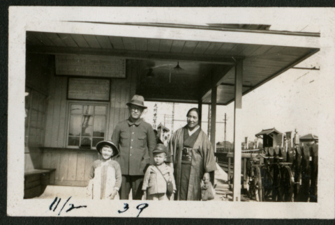 Family at train station (ddr-densho-359-1020)