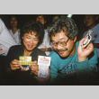 Kelly Kawakami and Alpha Goto with casino night winnings (ddr-densho-336-1814)