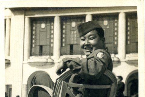 Soldier sitting on a chair (ddr-densho-22-297)