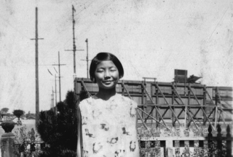 Chizu Kanda standing in yard (ddr-ajah-6-110)