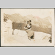 Woman sitting stone wall (ddr-densho-316-88)