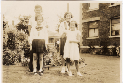 Photo of 1 young man and three girls (ddr-densho-383-511)