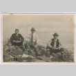 Three men sitting on rocks (ddr-densho-348-88)