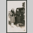 two women standing next to a car (ddr-densho-378-765)
