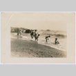 Group playing at the shore (ddr-densho-433-602)