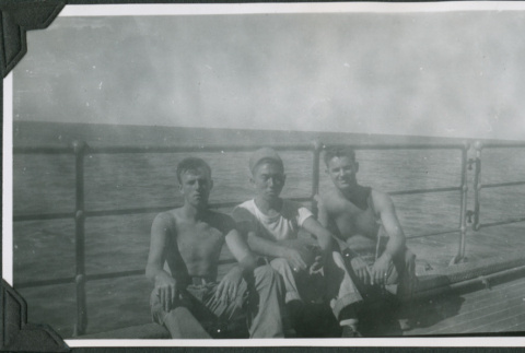 Three men on ship.  Joe Iwataki in center (ddr-ajah-2-646)