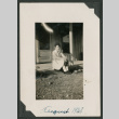 woman sitting on porch (ddr-densho-378-661)