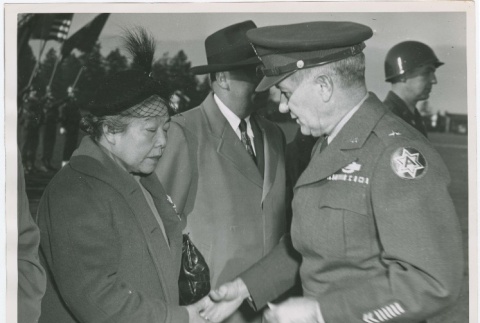 (Photograph) - Image of army officer and woman shaking hands (PDF) (ddr-densho-332-34-mezzanine-e66dc88d3d)