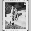 Woman in saddle shoes sitting on steps (ddr-densho-434-447)