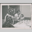 Man feeding small girl (ddr-densho-293-146)