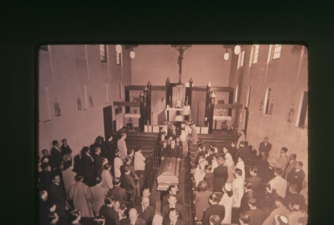 (Slide) - Image of funeral procession inside church (ddr-densho-330-18-master-2208c1f043)