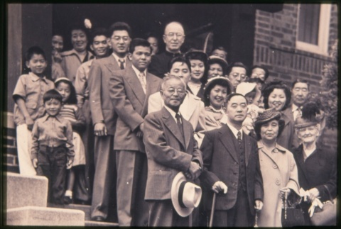 Group of men and women standing on steps outisde building (Maryknoll) (ddr-densho-330-196)