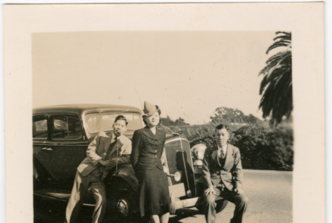 Tomoye (Nozawa) Takahashi and two men next to car (ddr-densho-426-1612)