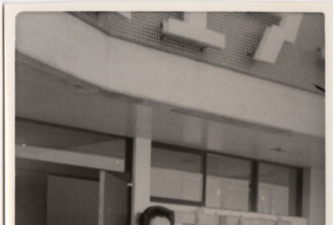 Man standing in front of business (ddr-densho-426-91)