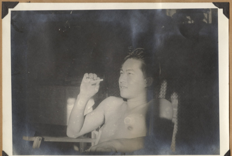Man smoking a cigarette (ddr-densho-542-149)